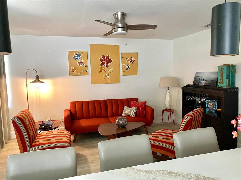 415 Mapleway, Unit A & B Safety Harbor, FL 34695 - Photo 10 of 56 a living room with furniture and a fireplace