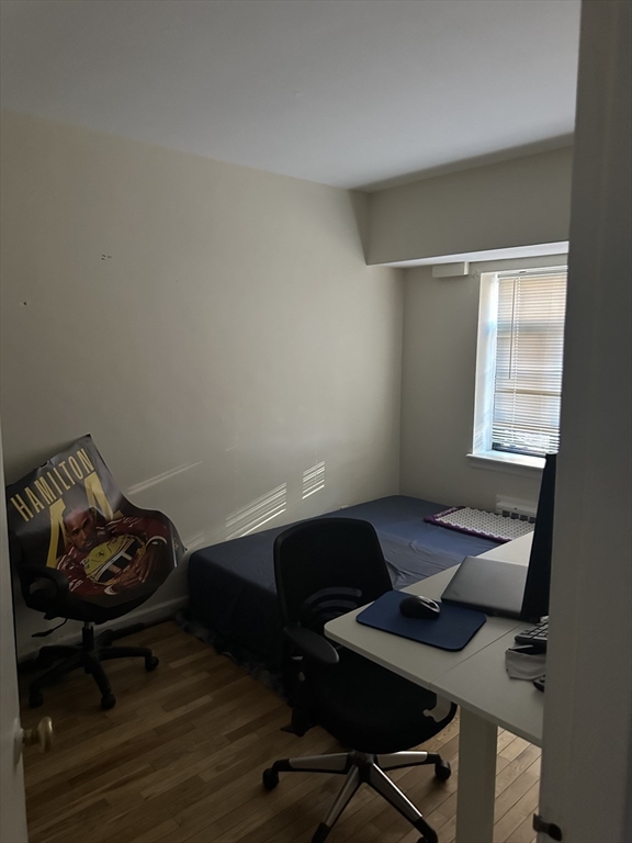 69 A Strathmore Road, Unit 69A Boston, MA 02135 - Photo 10 of 12 a workspace with furniture and a window