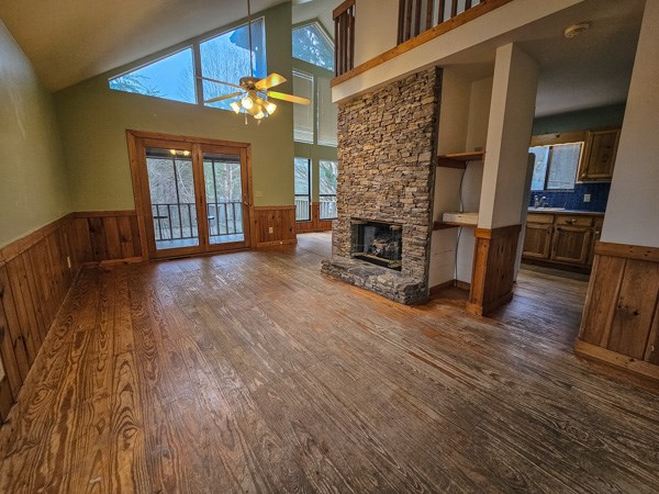 104 Pine Ridge Road Ellijay, GA 30536 - Photo 11 of 49 a view of a livingroom with wooden floor and a fireplace