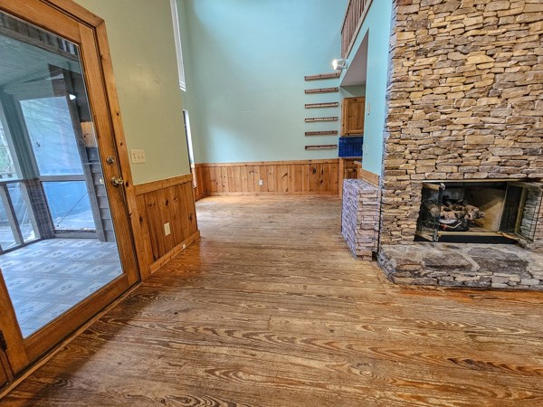 104 Pine Ridge Road Ellijay, GA 30536 - Photo 13 of 49 a view of an empty room with wooden floor and a fireplace