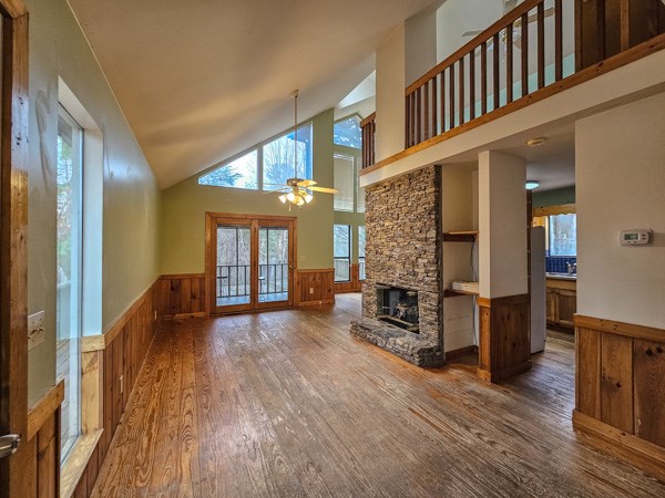104 Pine Ridge Road Ellijay, GA 30536 - Photo 16 of 49 a view of an entryway with wooden floor fireplace and windows
