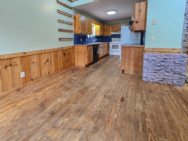 104 Pine Ridge Road Ellijay, GA 30536 - Photo 18 of 49 wooden floor with kitchen view