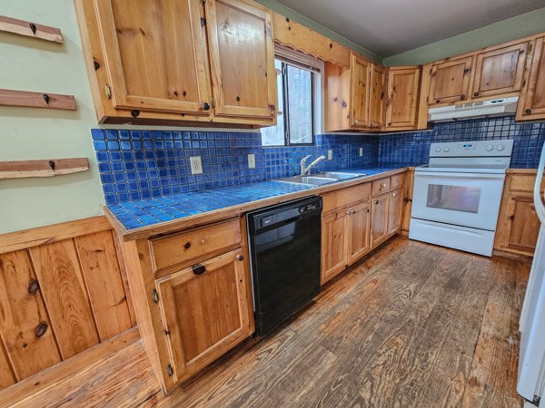 104 Pine Ridge Road Ellijay, GA 30536 - Photo 21 of 49 a kitchen with stainless steel appliances granite countertop a sink a stove and cabinets