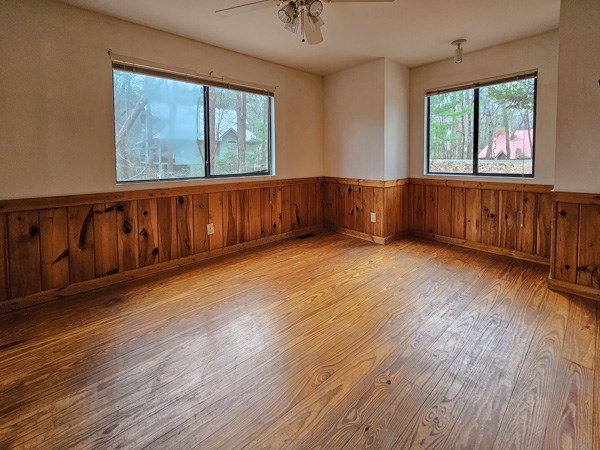 104 Pine Ridge Road Ellijay, GA 30536 - Photo 24 of 49 a view of an empty room with wooden floor and a window