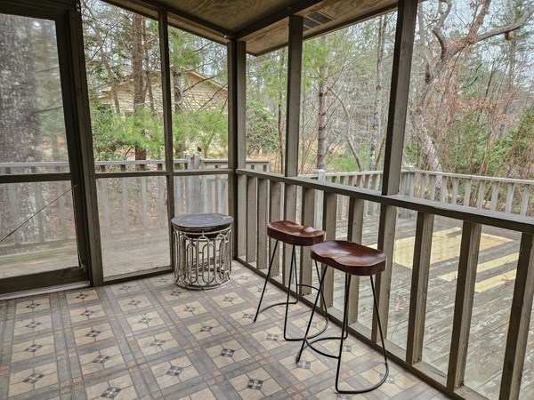 104 Pine Ridge Road Ellijay, GA 30536 - Photo 36 of 49 a view of a chairs and table in the balcony