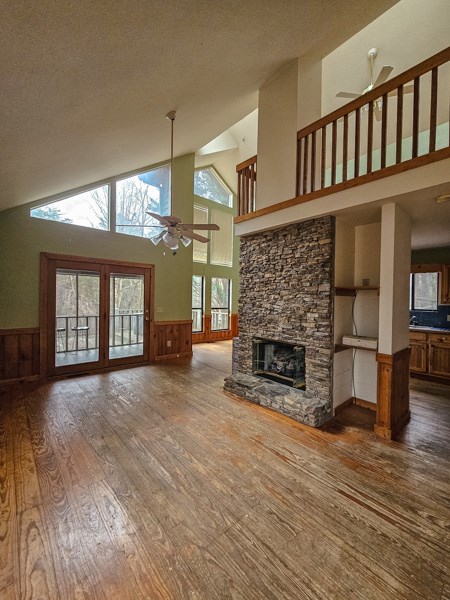 104 Pine Ridge Road Ellijay, GA 30536 - Photo 38 of 49 a living room with furniture a fireplace and a floor to ceiling window
