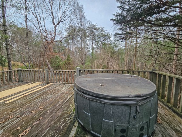 104 Pine Ridge Road Ellijay, GA 30536 - Photo 47 of 49 a view of a balcony with wooden floor and fence