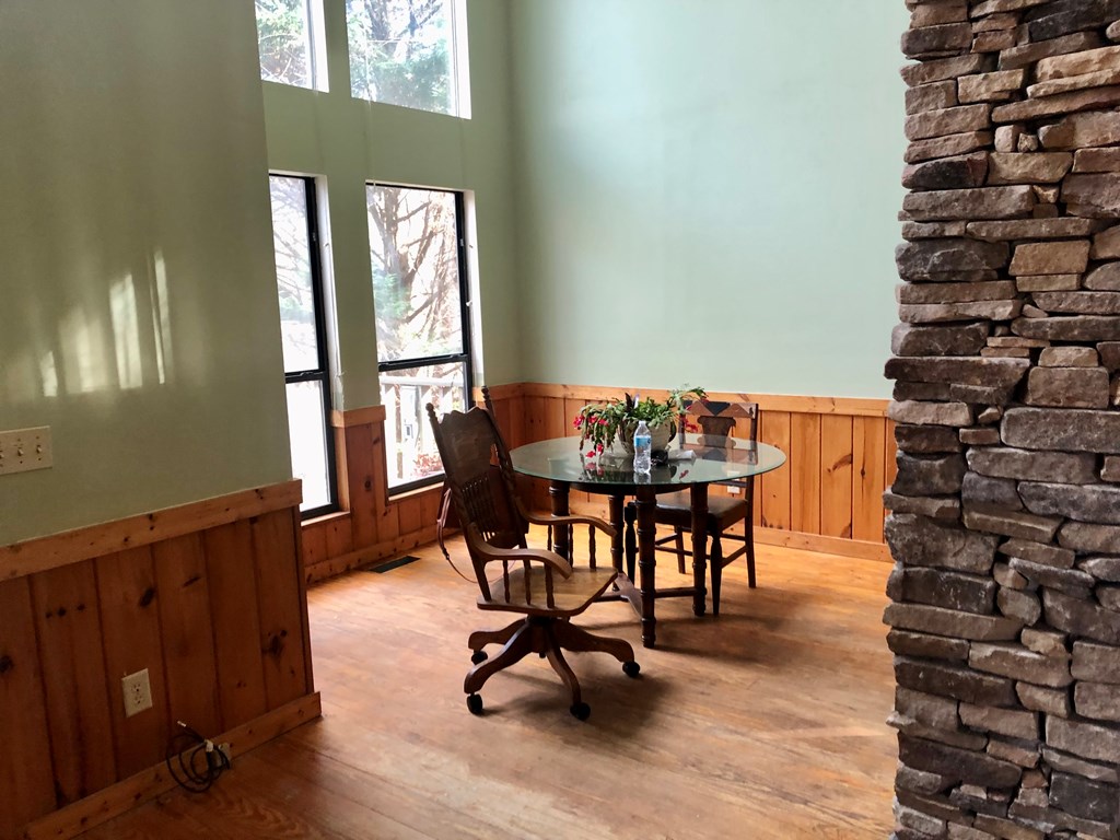 104 Pine Ridge Road Ellijay, GA 30536 - Photo 6 of 49 a view of a dining room with furniture and wooden floor