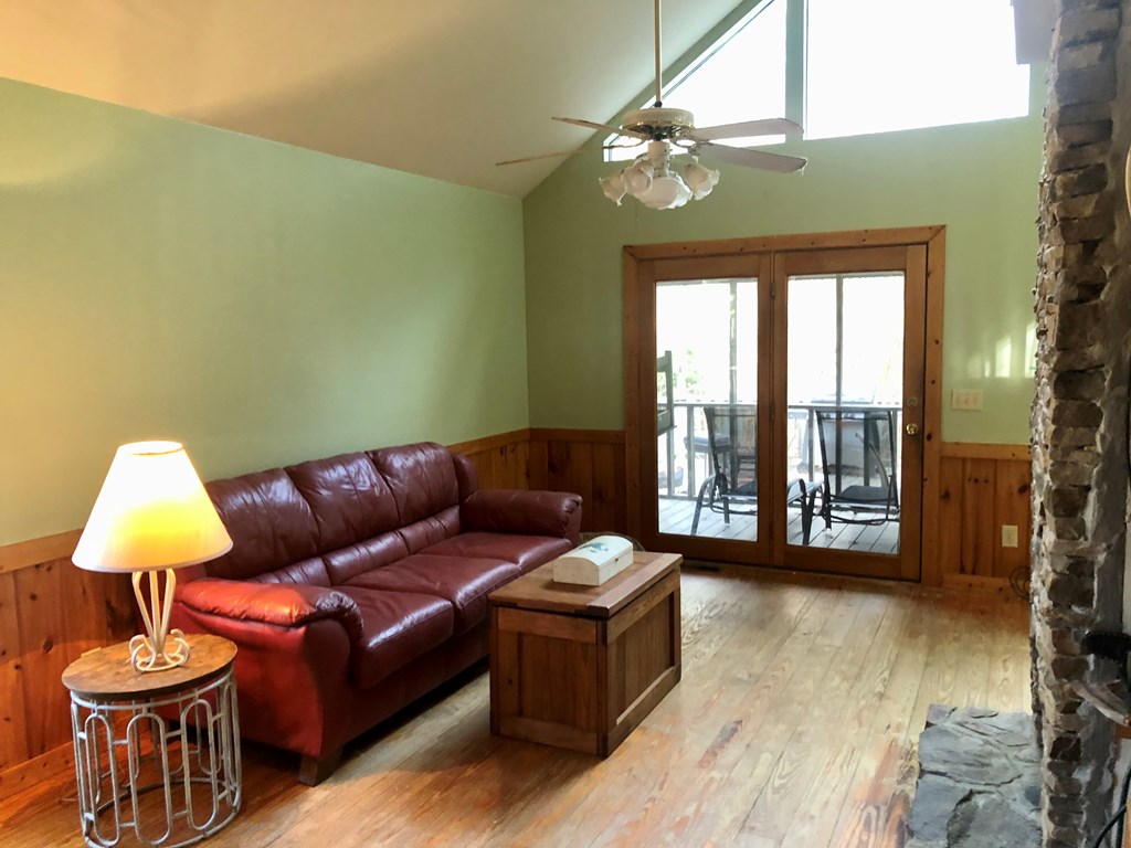 104 Pine Ridge Road Ellijay, GA 30536 - Photo 7 of 49 a living room with furniture and a large window