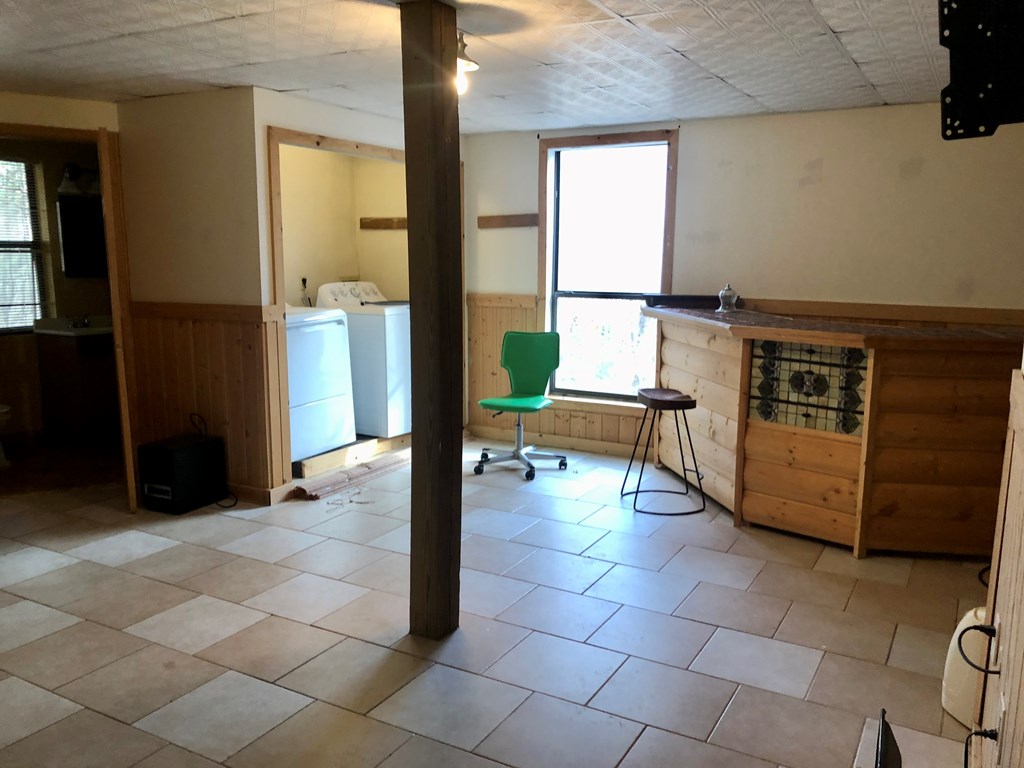 104 Pine Ridge Road Ellijay, GA 30536 - Photo 9 of 49 a living room with furniture a dining table and a large window