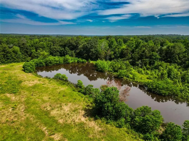 a view of a lake with a yard