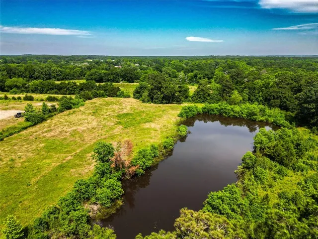 a view of a lake with a yard