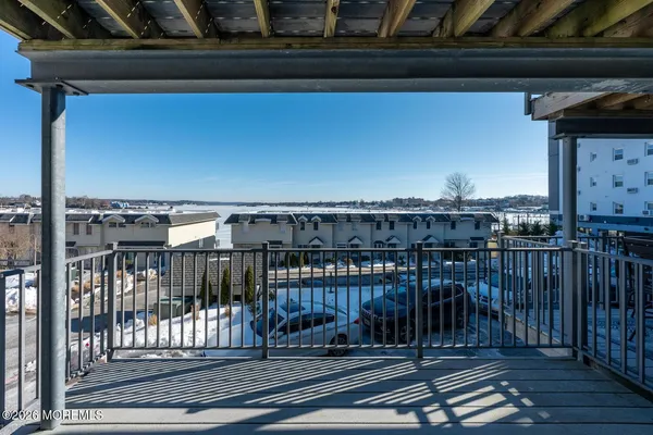 a view of a balcony with wooden floor
