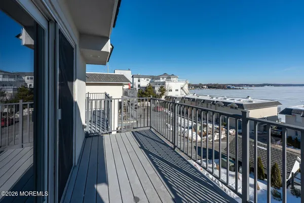a view of a balcony with wooden floor