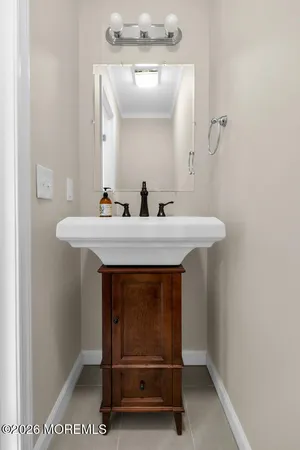 a bathroom with a sink a mirror and a vanity