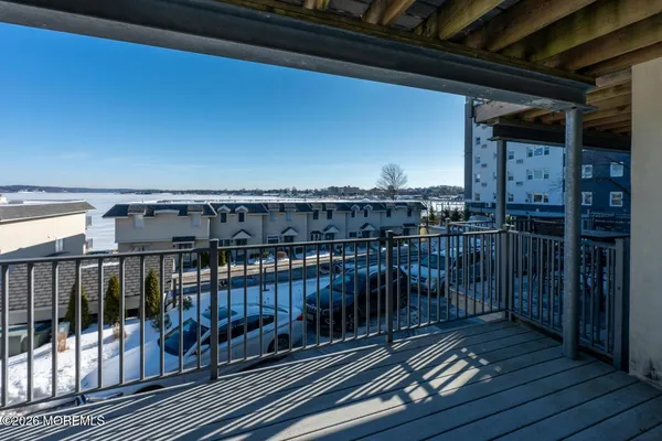 a view of balcony with wooden floor