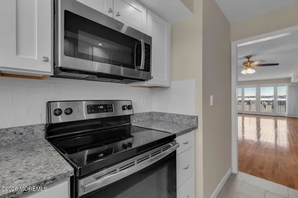 a kitchen with a stove and a microwave
