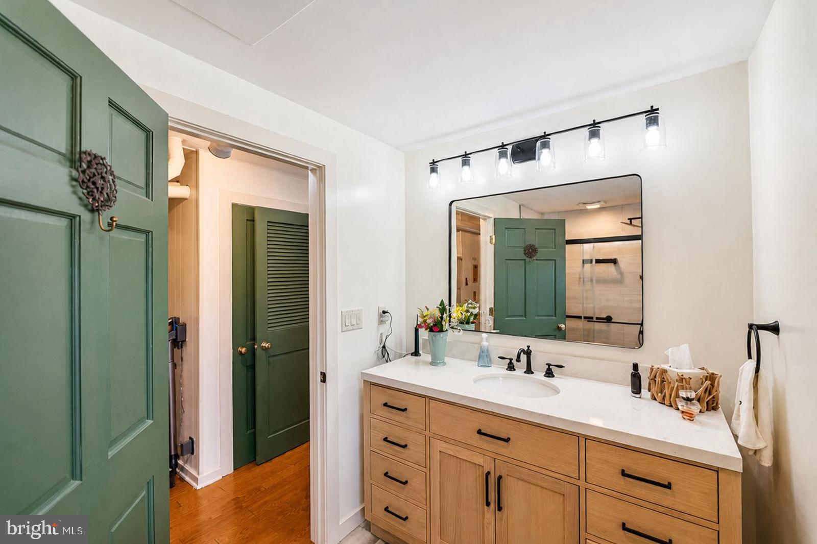222 Blue School Road Perkasie, PA 18944 - Photo 27 of 77 a bathroom with a double vanity sink and a mirror
