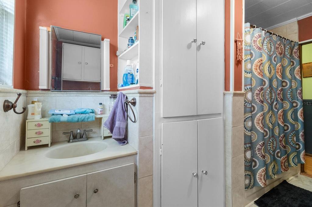 1226 South Telephone Point Road Inverness, FL 34450 - Photo 27 of 43 a bathroom with a sink and a mirror