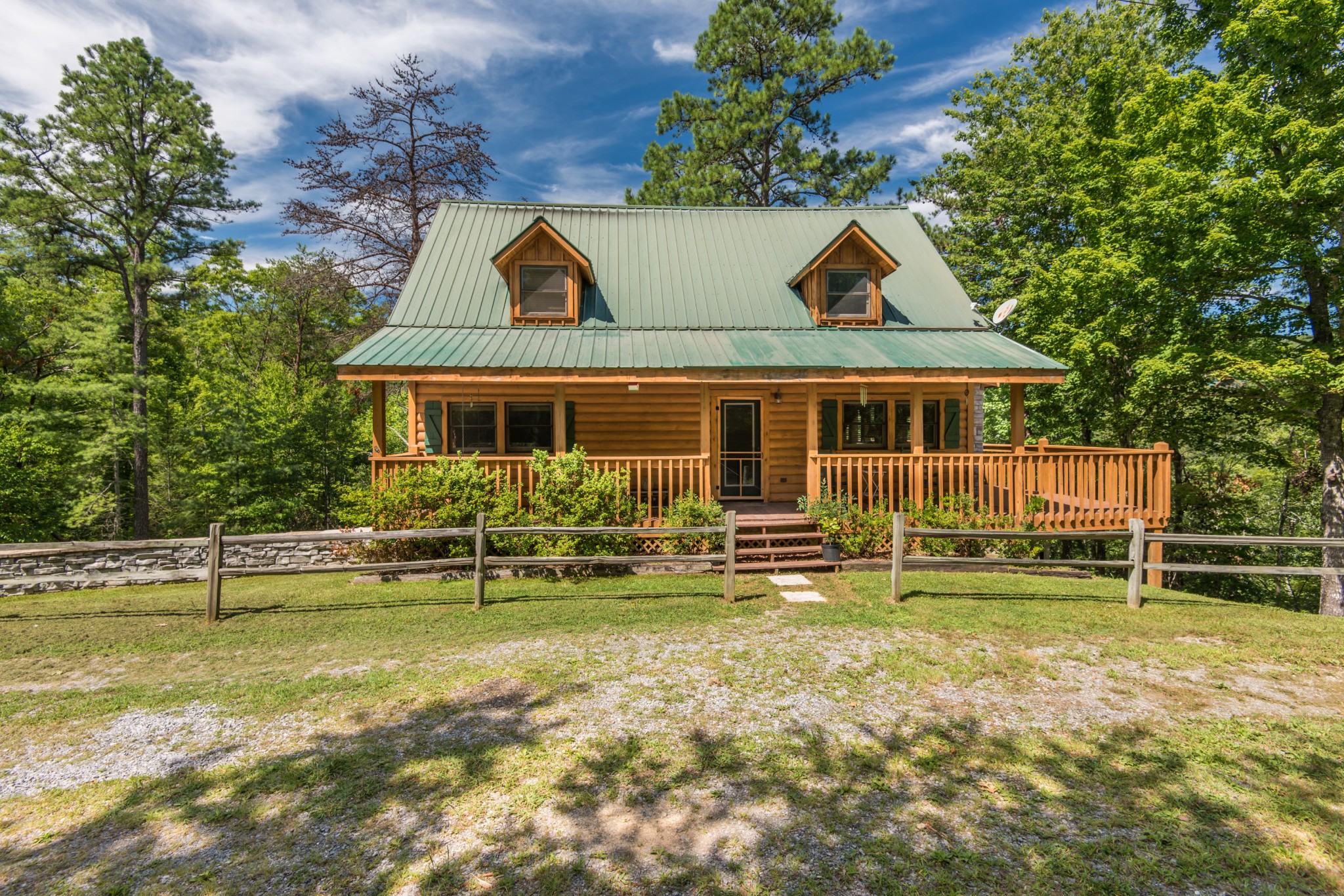 3104 Clearview Road Sevierville, TN 37862 - Photo 1 of 36 a front view of a house with a yard table and chairs