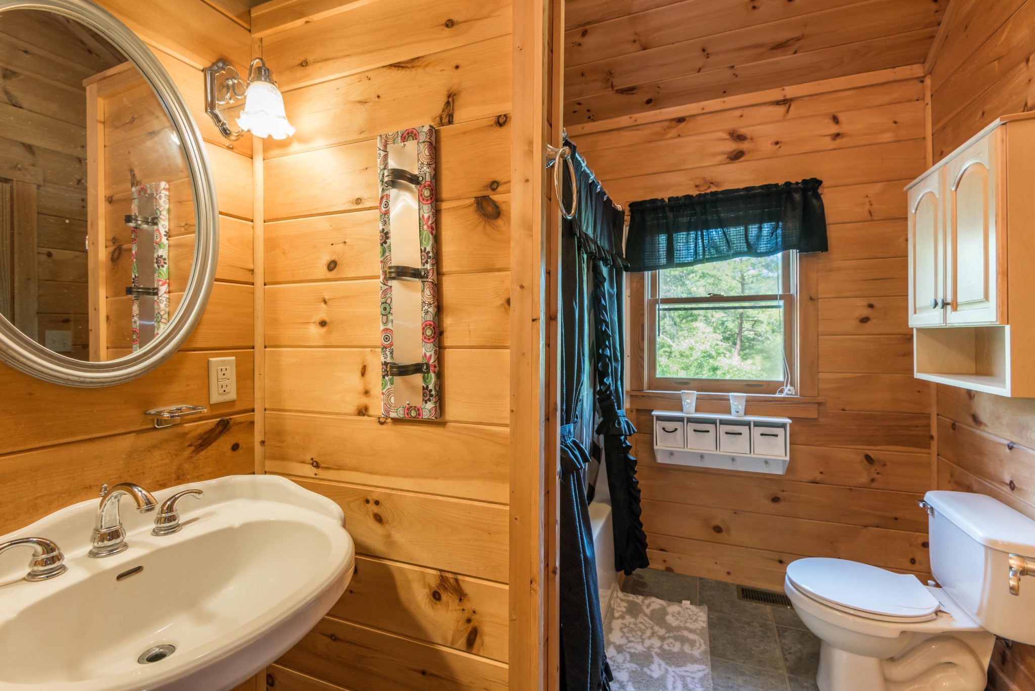 3104 Clearview Road Sevierville, TN 37862 - Photo 28 of 36 a bathroom with a sink and a mirror