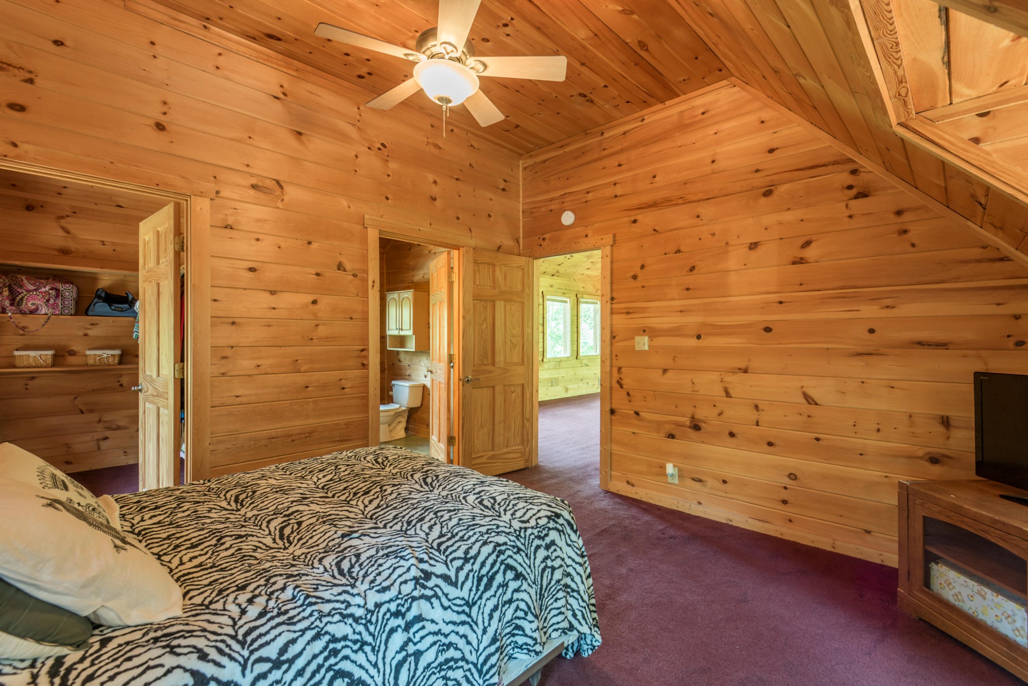 3104 Clearview Road Sevierville, TN 37862 - Photo 29 of 36 a bedroom with a bed and a walk in closet
