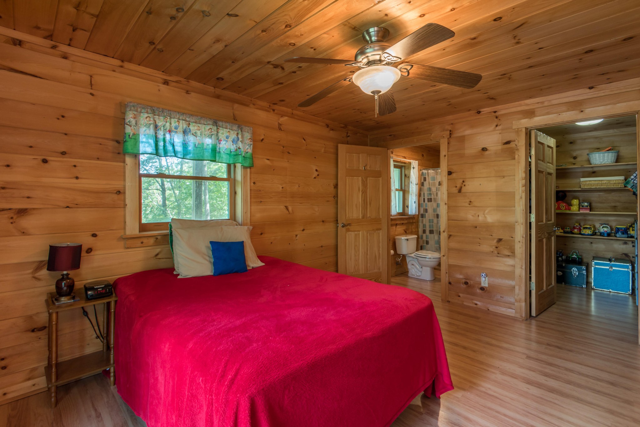 3104 Clearview Road Sevierville, TN 37862 - Photo 33 of 36 a bed sitting in a bedroom next to a window