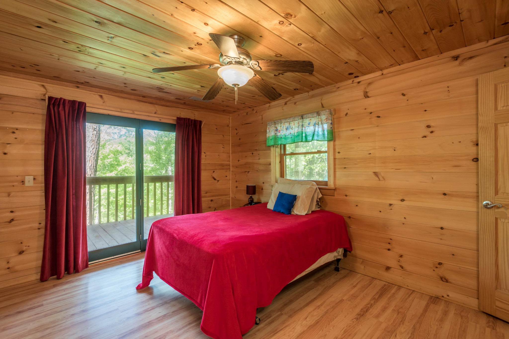 3104 Clearview Road Sevierville, TN 37862 - Photo 34 of 36 a bed sitting in a bedroom next to a window