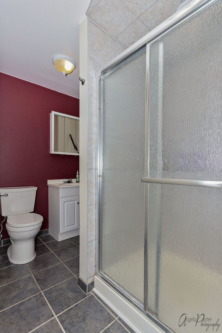 28451 Valley Road Ingleside, IL 60041 - Photo 13 of 21 a bathroom with a toilet and a shower