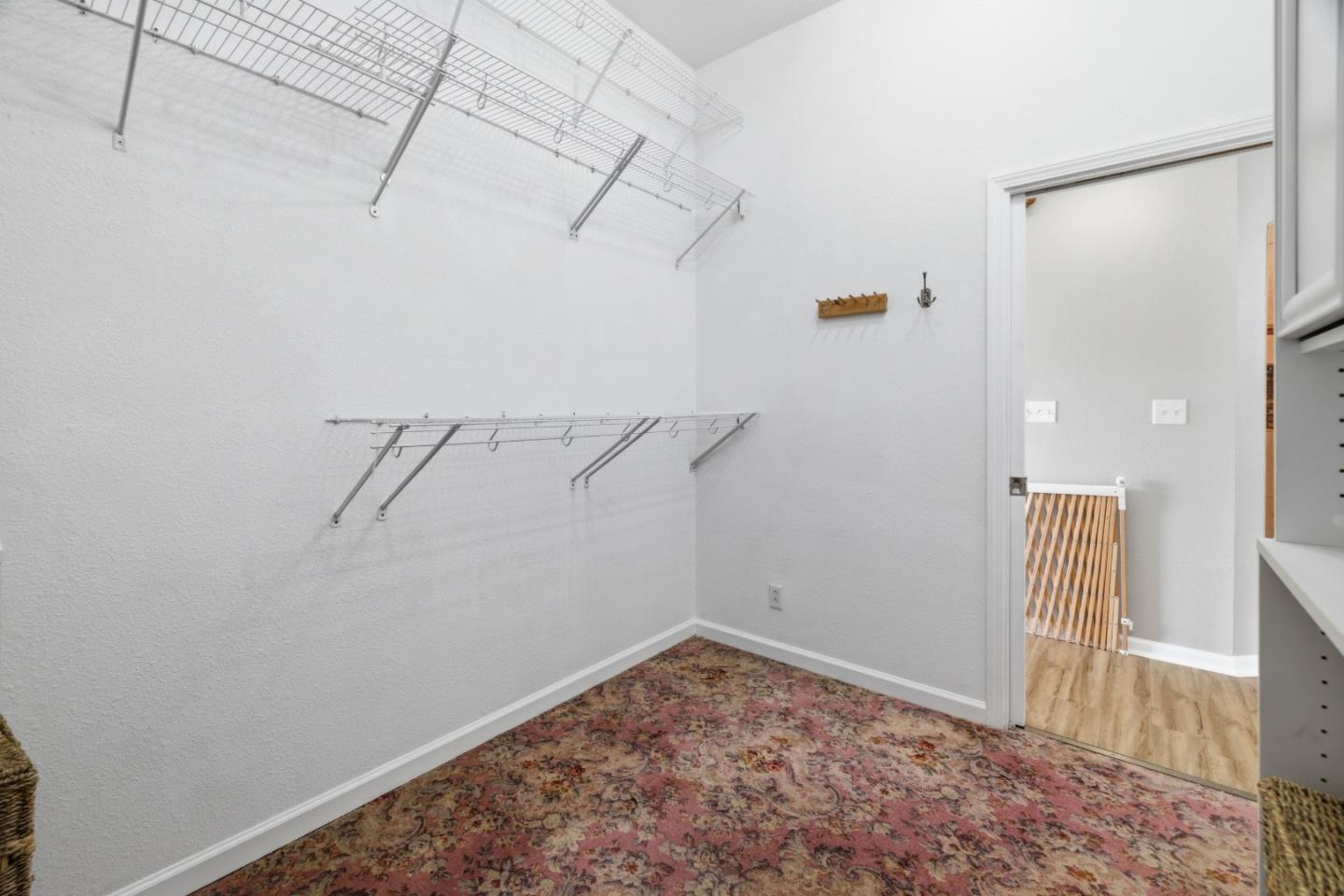 19269 Mallory Canyon Road, Unit D Salinas, CA 93907 - Photo 27 of 77 a view of a room with racks on the wall