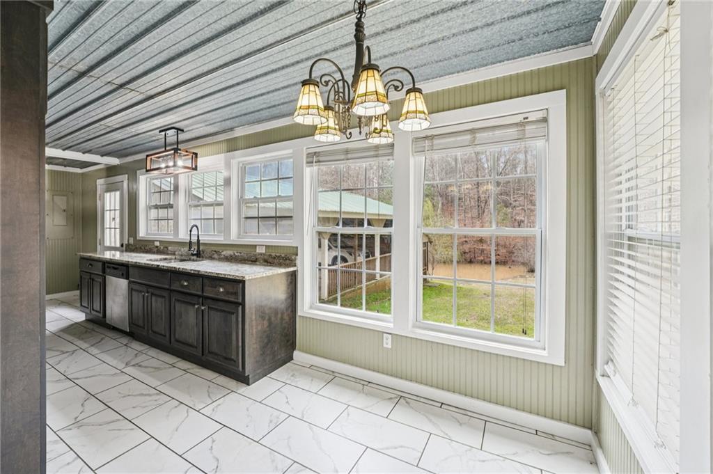 257 Shellhorse Road Southeast Ranger, GA 30734 - Photo 11 of 44 a kitchen with granite countertop a stove and a sink