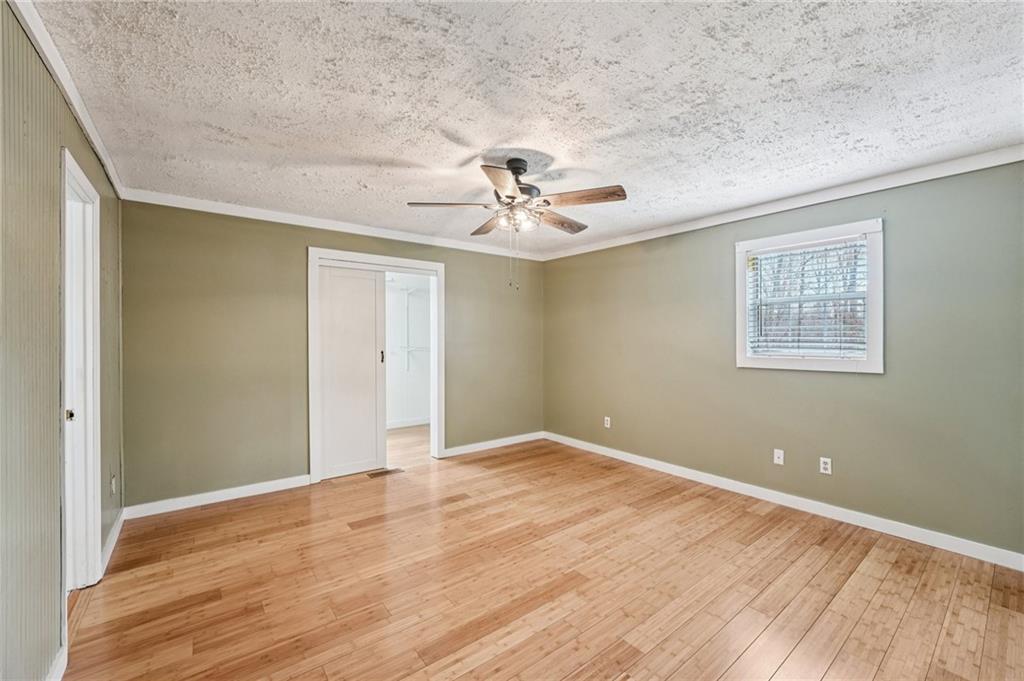 257 Shellhorse Road Southeast Ranger, GA 30734 - Photo 17 of 44 wooden floor in an empty room with a window