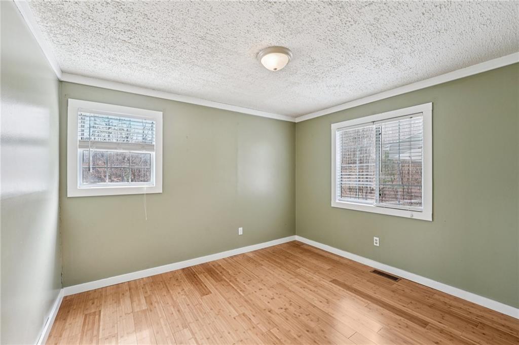 257 Shellhorse Road Southeast Ranger, GA 30734 - Photo 21 of 44 a view of a room with wooden floor and windows
