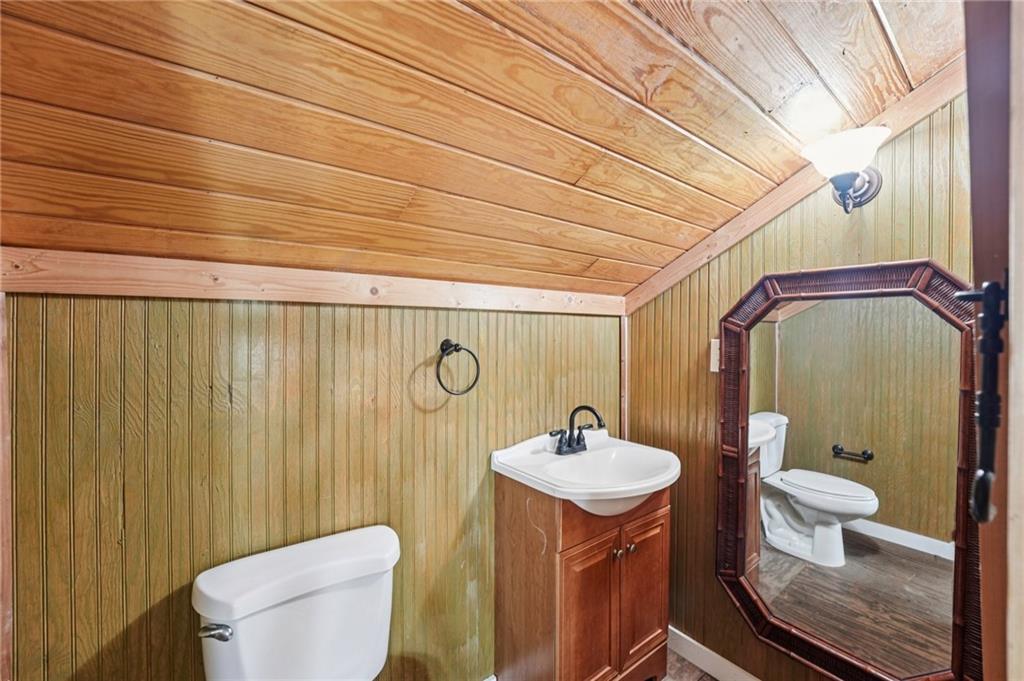 257 Shellhorse Road Southeast Ranger, GA 30734 - Photo 27 of 44 a bathroom with a toilet sink and mirror