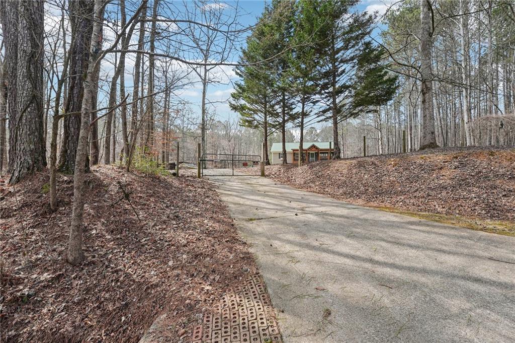 257 Shellhorse Road Southeast Ranger, GA 30734 - Photo 40 of 44 a backyard of a house with lots of green space