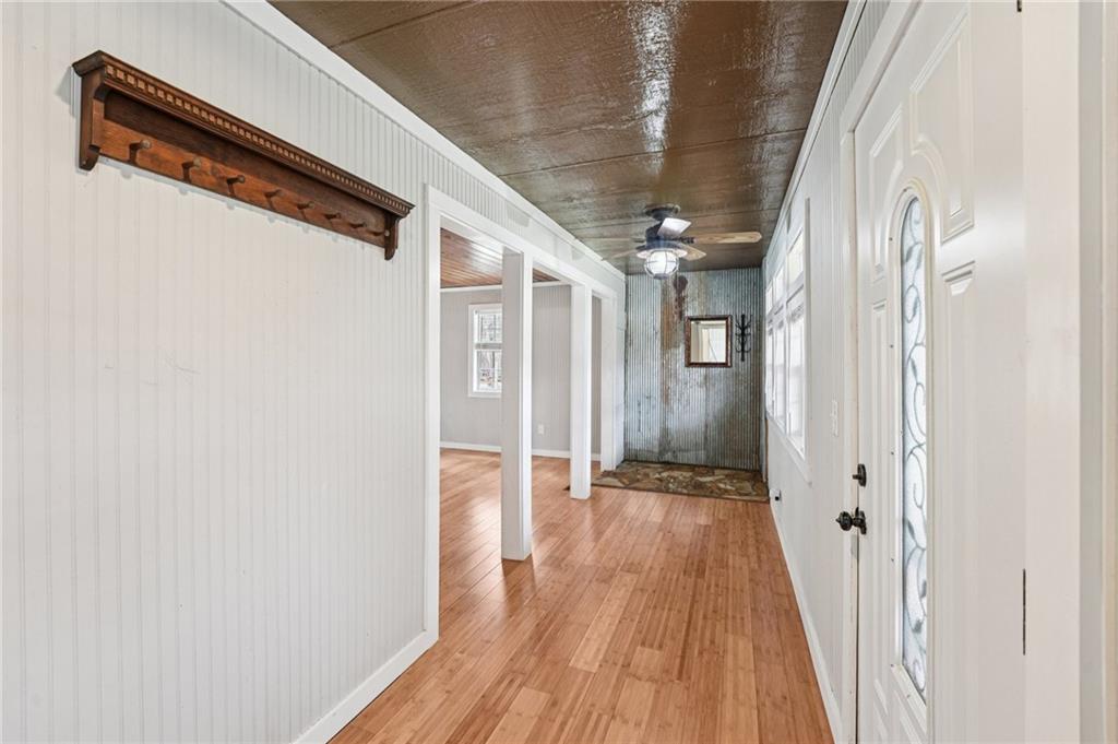 257 Shellhorse Road Southeast Ranger, GA 30734 - Photo 4 of 44 a view of a hallway with wooden floor and staircase