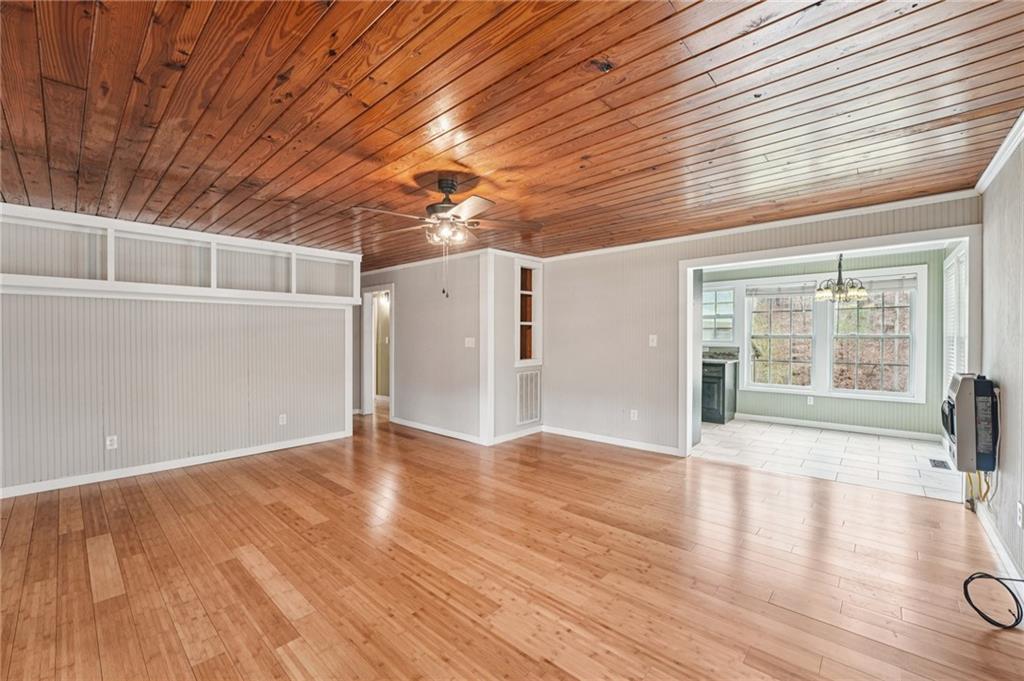 257 Shellhorse Road Southeast Ranger, GA 30734 - Photo 6 of 44 a view of an empty room with wooden floor and a window