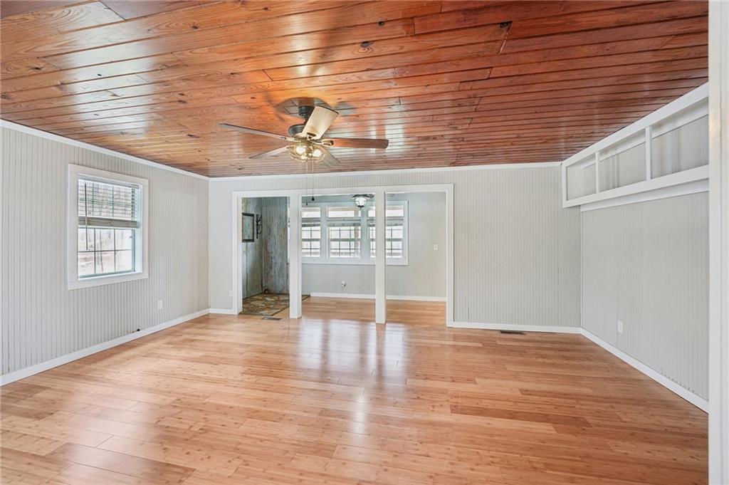 257 Shellhorse Road Southeast Ranger, GA 30734 - Photo 9 of 44 a view of an empty room with a window and wooden floor