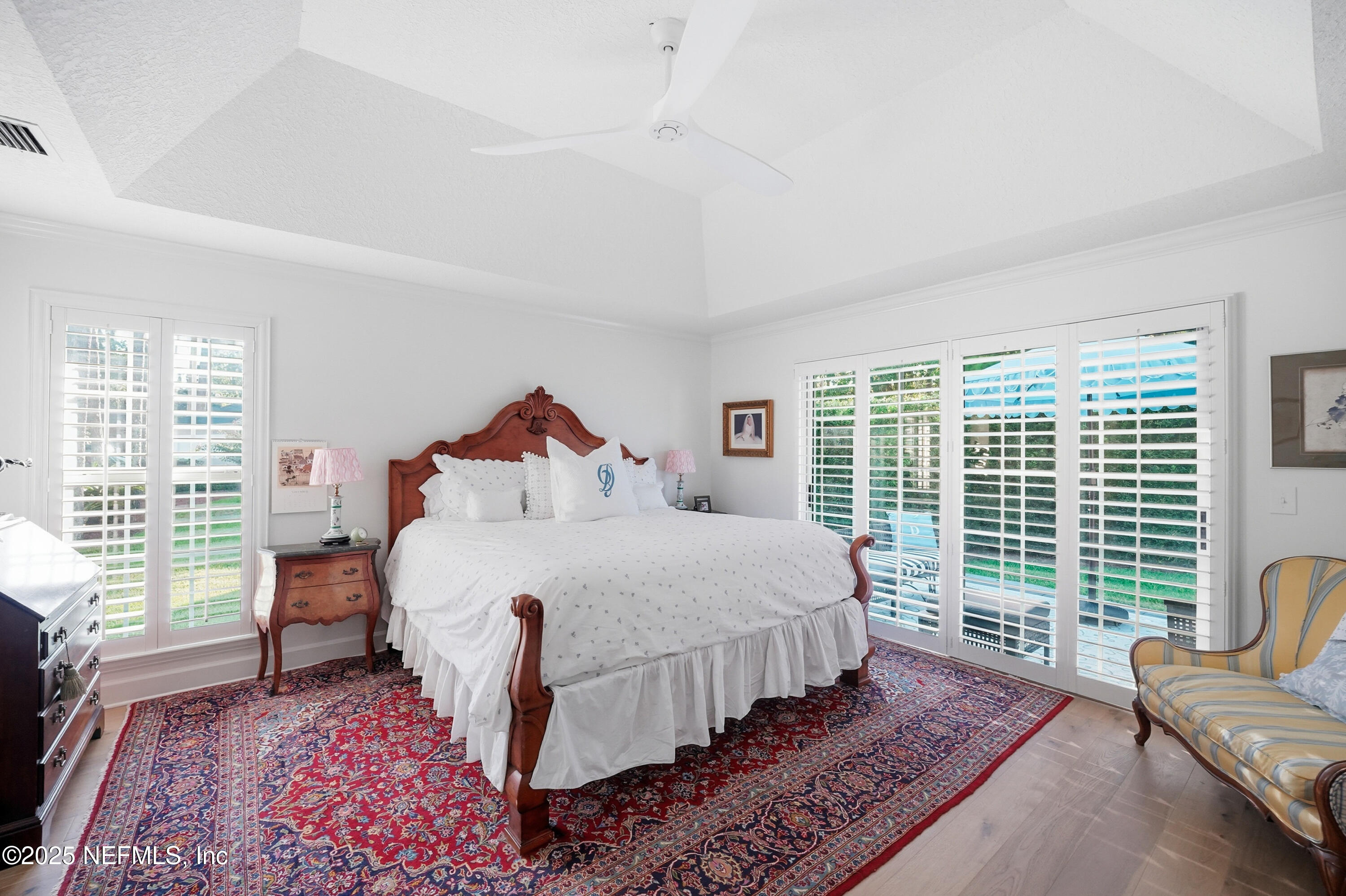 1202 Salt Creek Pointe Way Ponte Vedra Beach, FL 32082 - Photo 24 of 77 a bedroom with a large bed and a large window