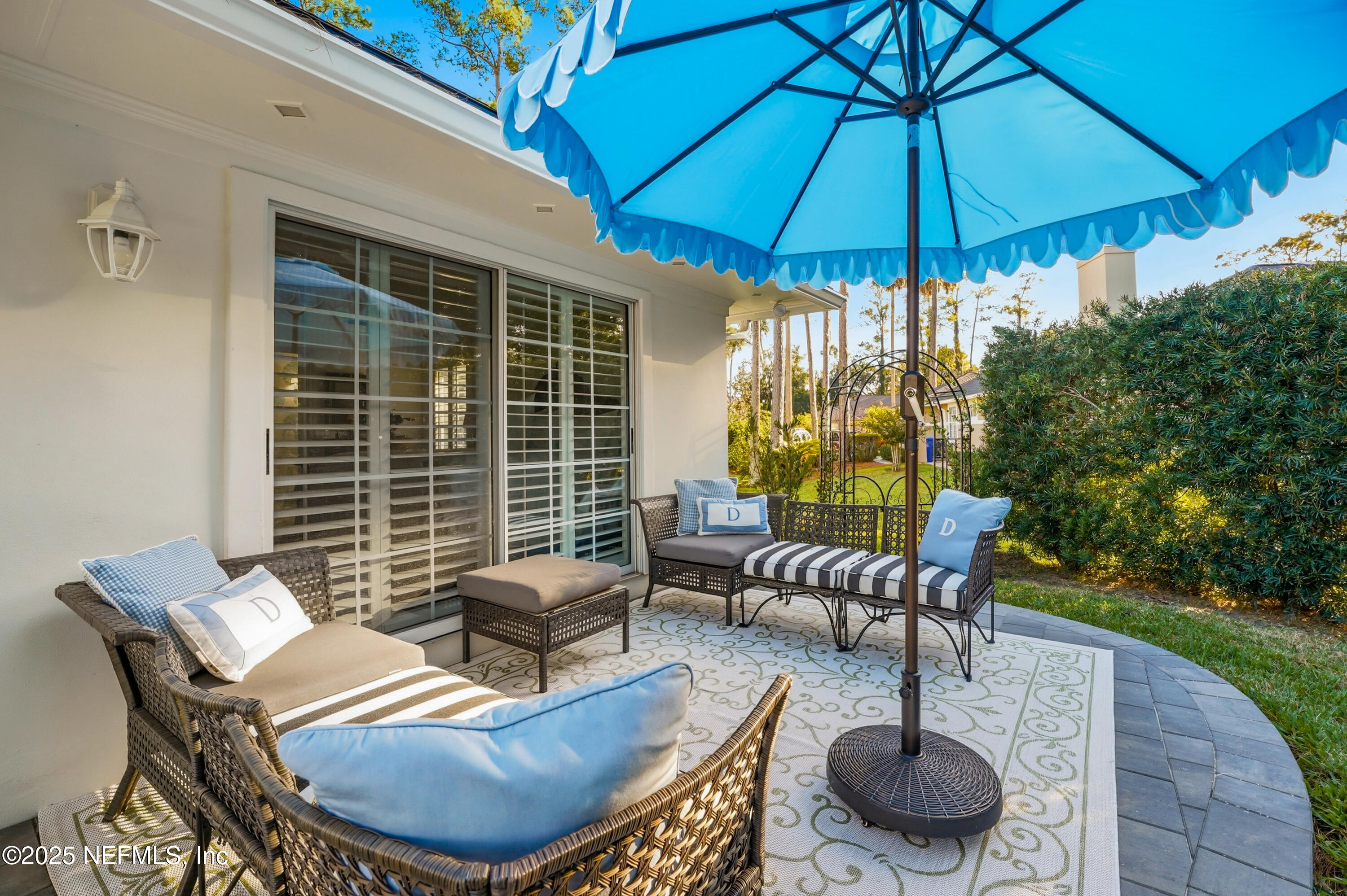 1202 Salt Creek Pointe Way Ponte Vedra Beach, FL 32082 - Photo 43 of 77 a patio with a patio table and chairs