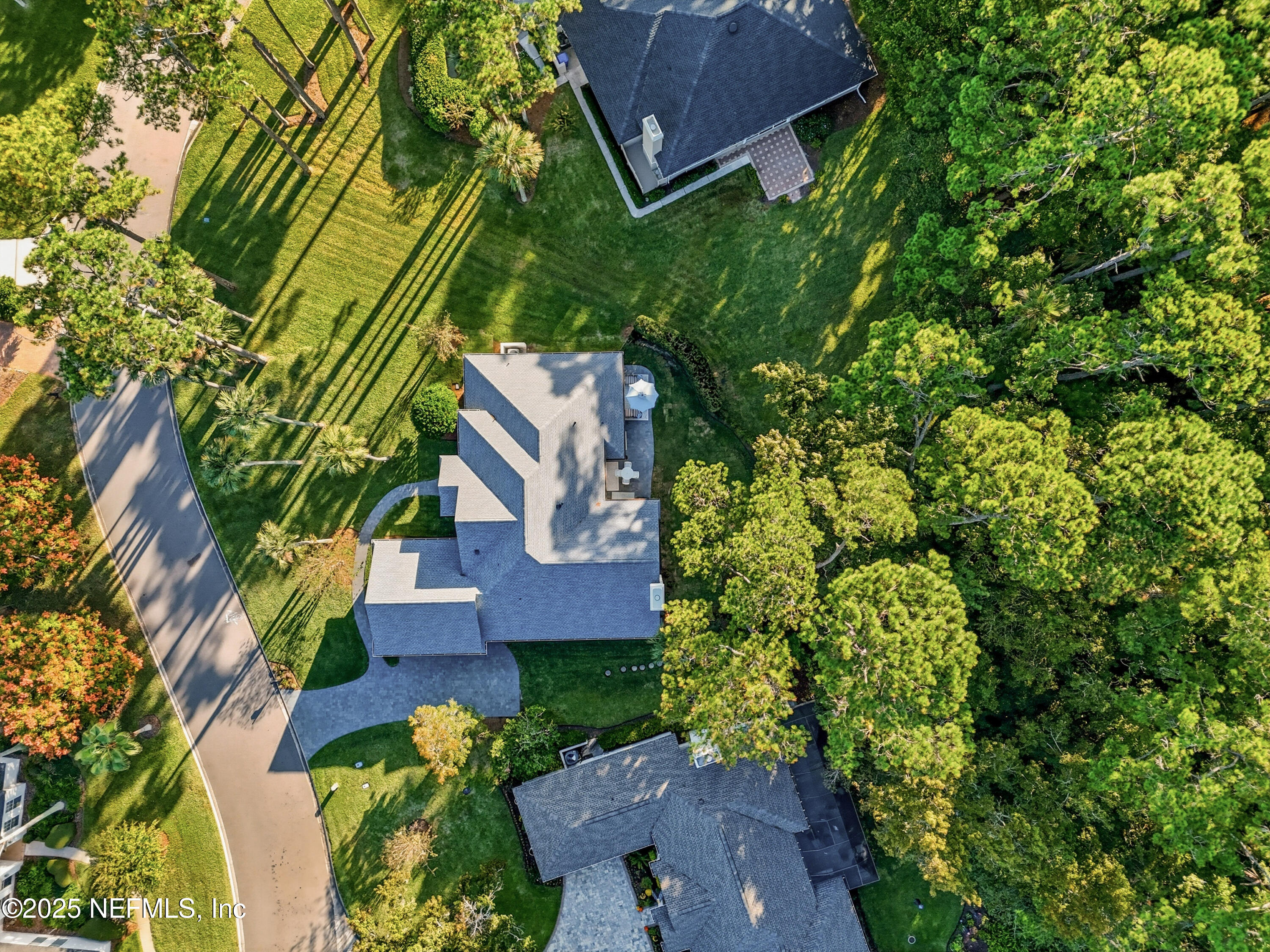 1202 Salt Creek Pointe Way Ponte Vedra Beach, FL 32082 - Photo 51 of 77 an aerial view of a house with a yard