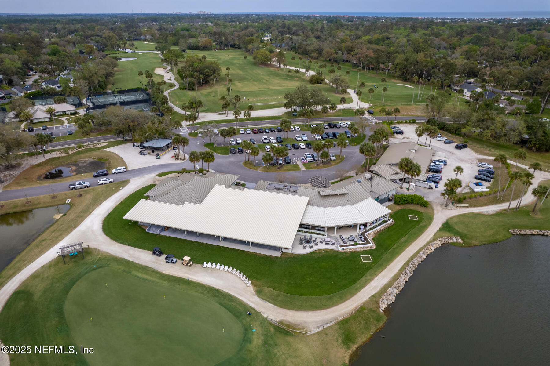 1202 Salt Creek Pointe Way Ponte Vedra Beach, FL 32082 - Photo 72 of 77 an aerial view of a house with a garden and lake view