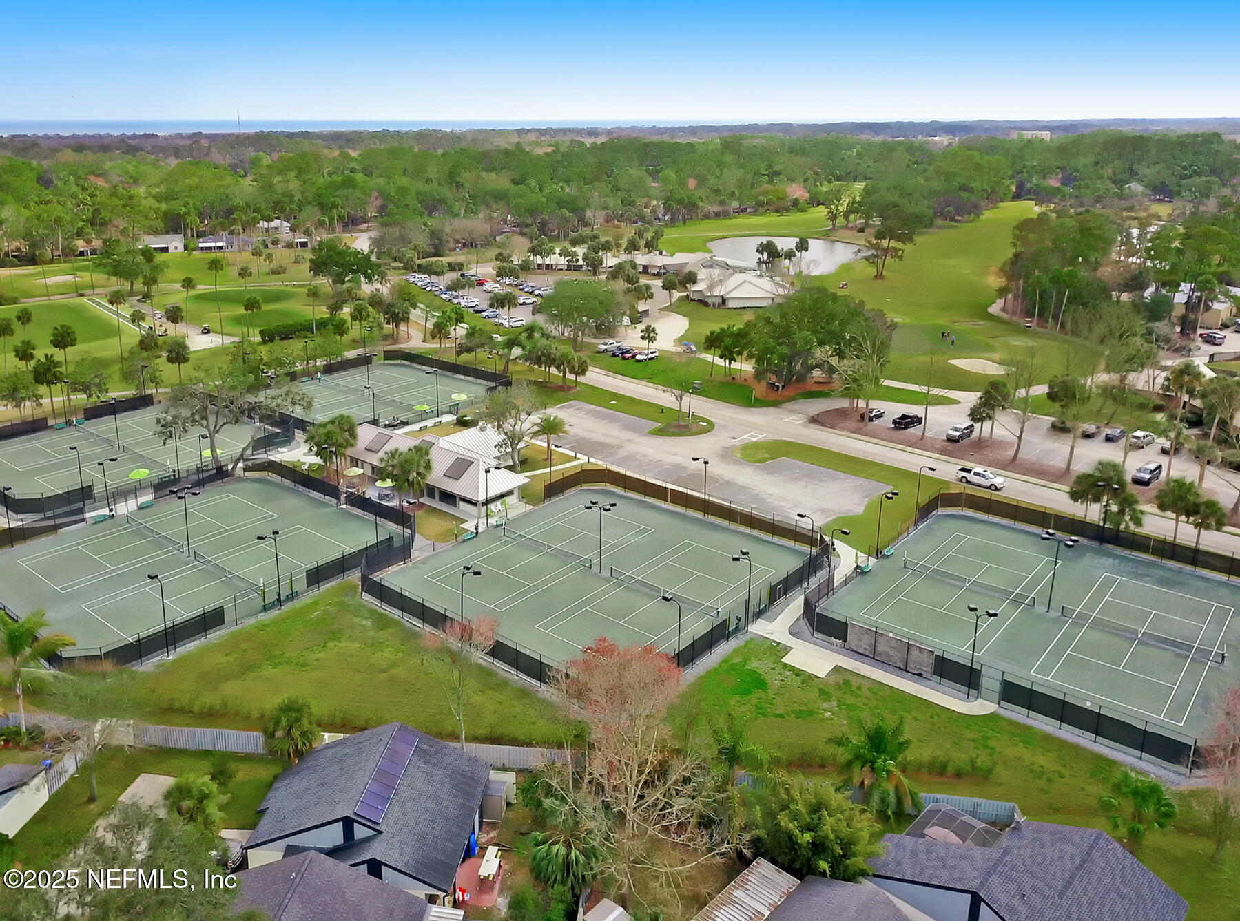 1202 Salt Creek Pointe Way Ponte Vedra Beach, FL 32082 - Photo 76 of 77 an aerial view of residential houses with outdoor space and river