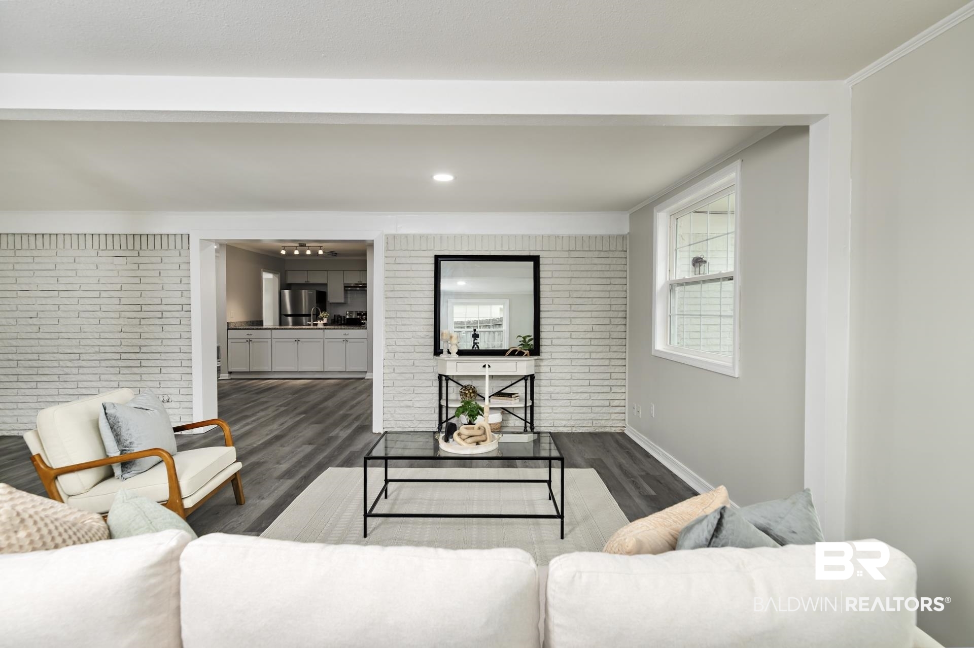 5922 Sunnyside Drive Mobile, AL 36619 - Photo 16 of 51 Living room featuring wood finished floors, ornamental molding, baseboards, and recessed lighting
