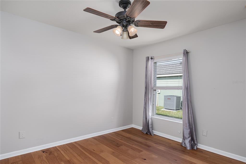 9822 50th St Circle East Parrish, FL 34219 - Photo 17 of 46 a view of an empty room with a window