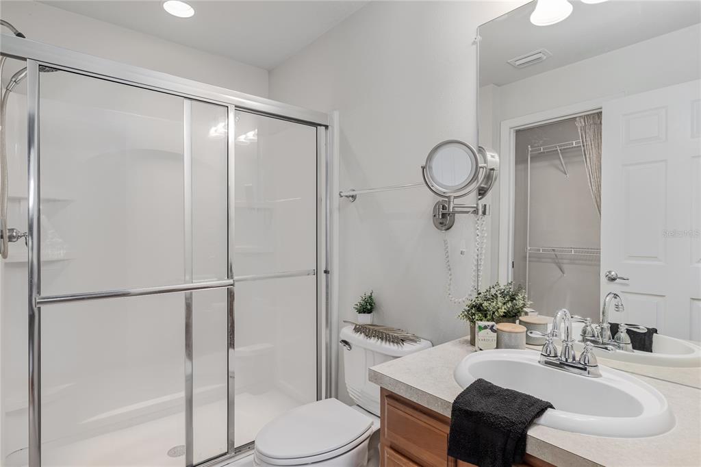 9822 50th St Circle East Parrish, FL 34219 - Photo 22 of 46 a bathroom with a sink toilet and shower