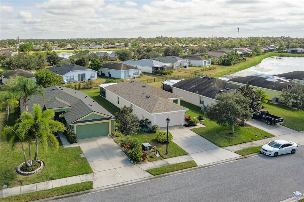 9822 50th St Circle East Parrish, FL 34219 - Photo 29 of 46 an aerial view of residential houses with outdoor space and parking