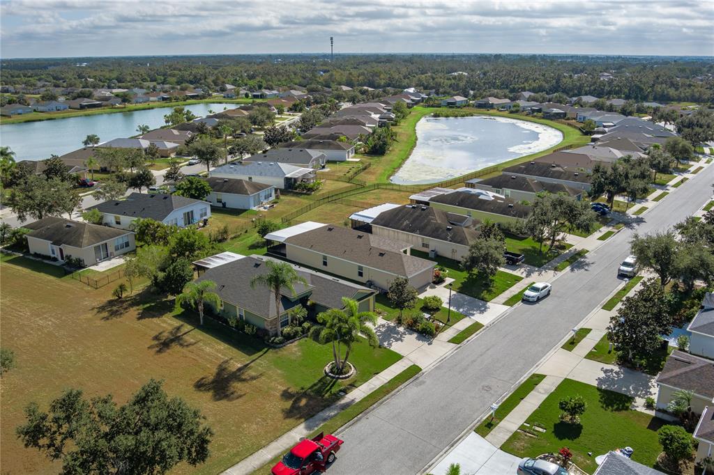 9822 50th St Circle East Parrish, FL 34219 - Photo 34 of 46 an aerial view of a city and lake view