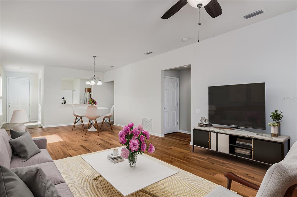 9822 50th St Circle East Parrish, FL 34219 - Photo 7 of 46 a living room with furniture and a flat screen tv