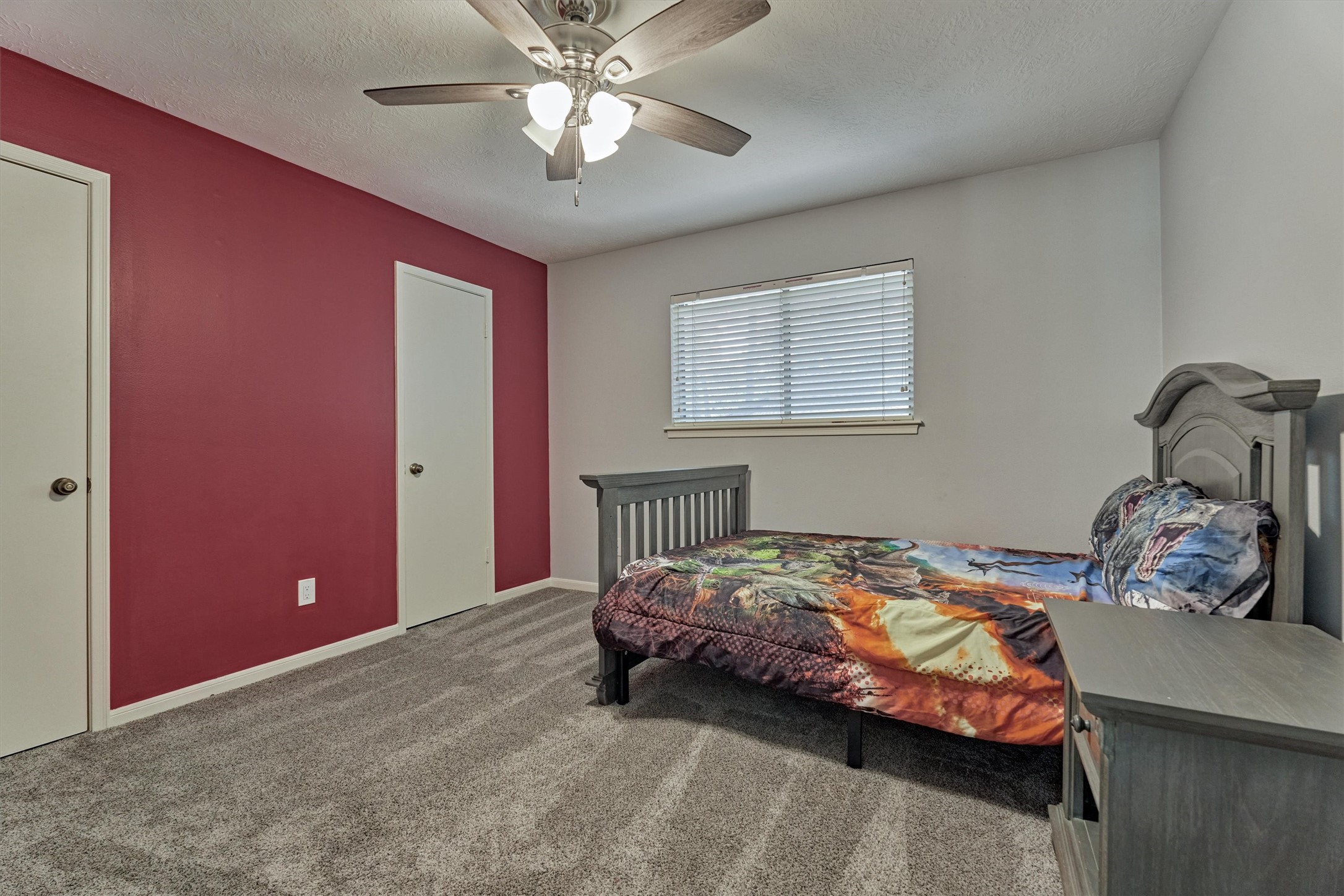 6522 Castle Pine Lane Spring, TX 77379 - Photo 43 of 49 a bedroom with a bed and a chandelier